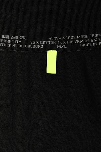 ILU Go with the Flow Leggings close up back waistband tab.   For sight impaired  and fully sighted wearers. Shows  which is  back and which is front. .High waisted, seamless, flared, lower leg split .