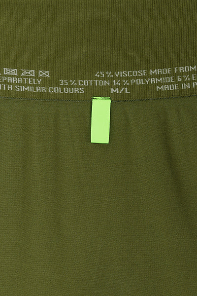 ILU Go with the Flow Leggings close up back waistband tab.   For sight impaired  and fully sighted wearers. Shows  which is  back and which is front. .High waisted, seamless, flared, lower leg split .