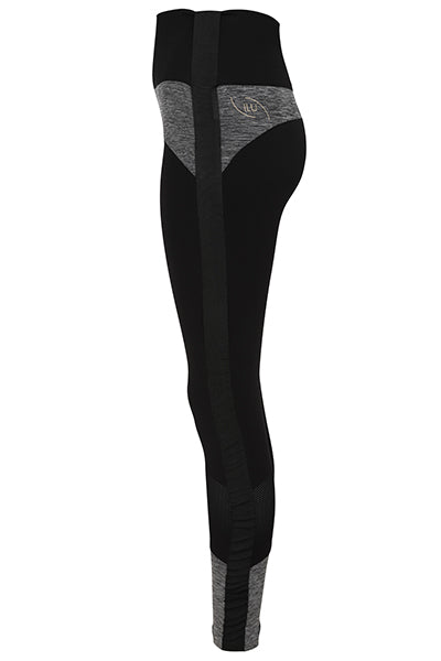 Cut out image of Adaptive Dream Spin Leggings side view showing adaptive feature tape on outer leg