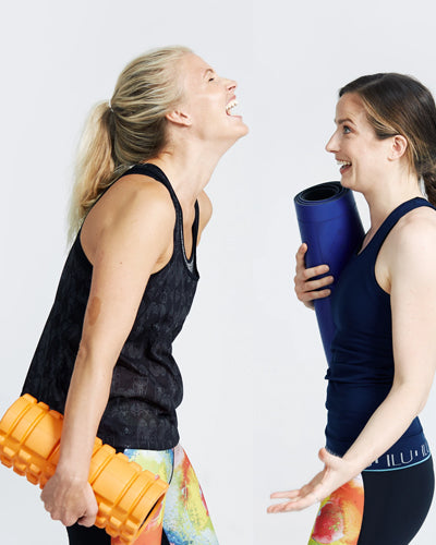 friends laughing wearing Motivate Me Vest
