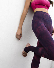 Vitality Leggings showing foot detail on model leaning against wall