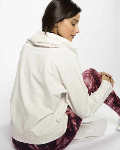 model sat wearing Oversized Dance Sweat back detail