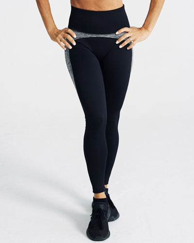 model posing wearing Motivate Me Leggings