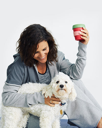 model drinking coffee and snuggling dog wearing The Chill Time Set 