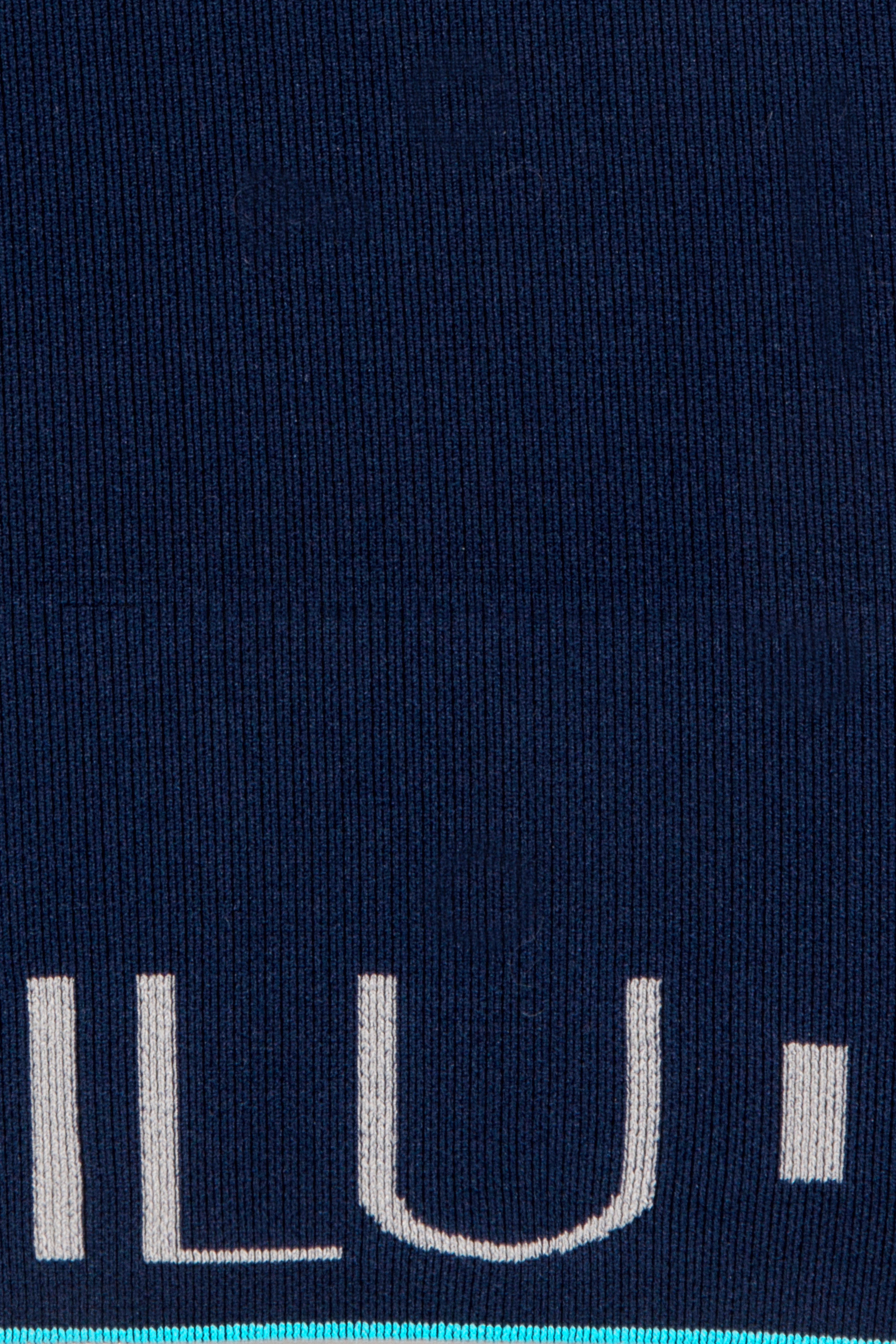 Motivate Me Vest hem band detail with sky blue accent and ILU branding — ILU Fitwear